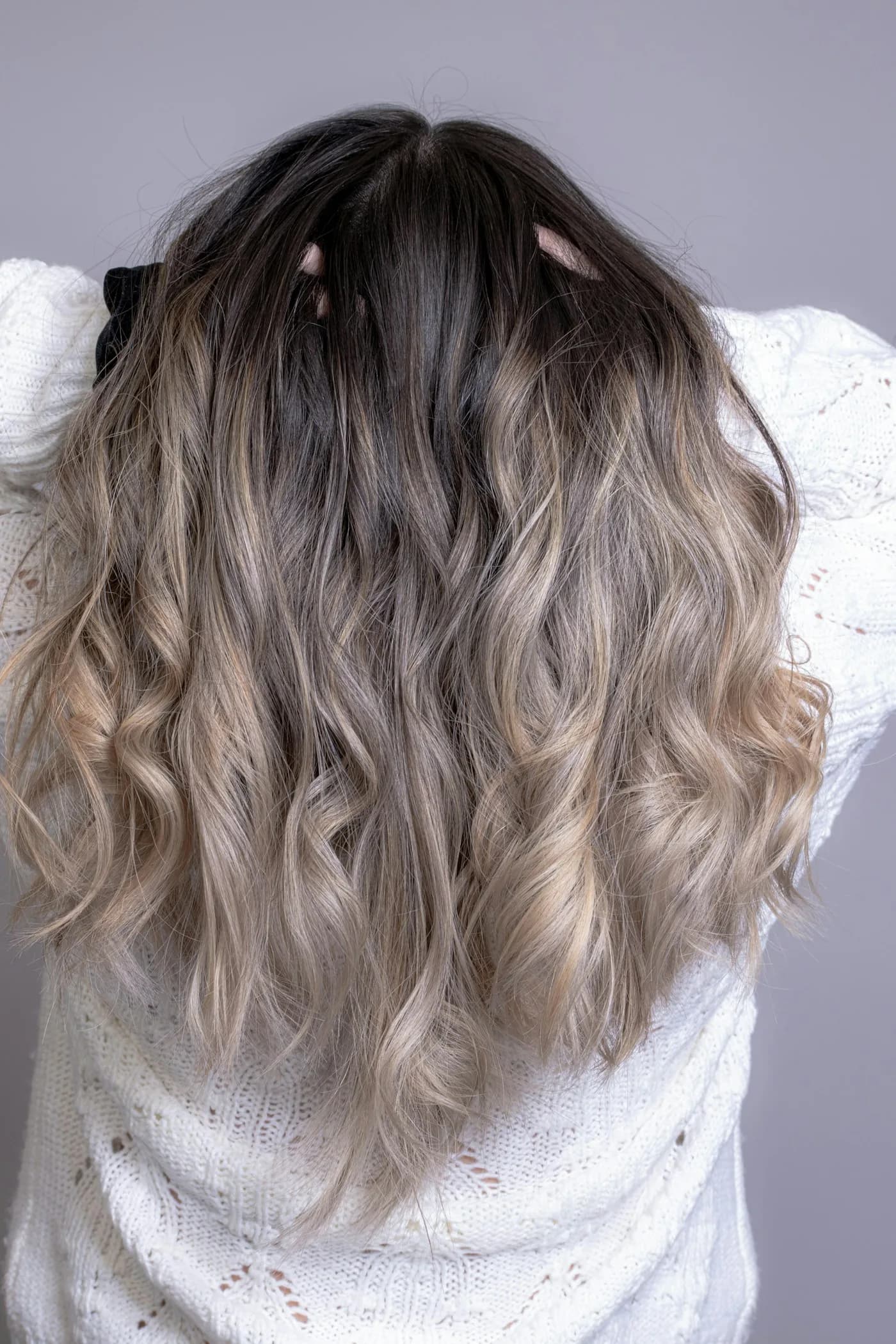 Rooted blonde balayage transformation, drag to compare the color before and after